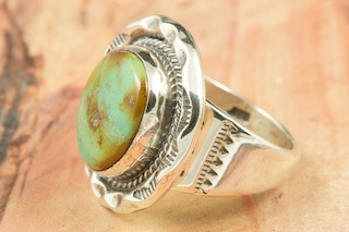 Genuine Crow Springs Turquoise set in Sterling Silver Ring. The Crow Springs Mine is located near Tonopah, Nevada. Created by Navajo Artist Wilson Padilla. Signed. 
